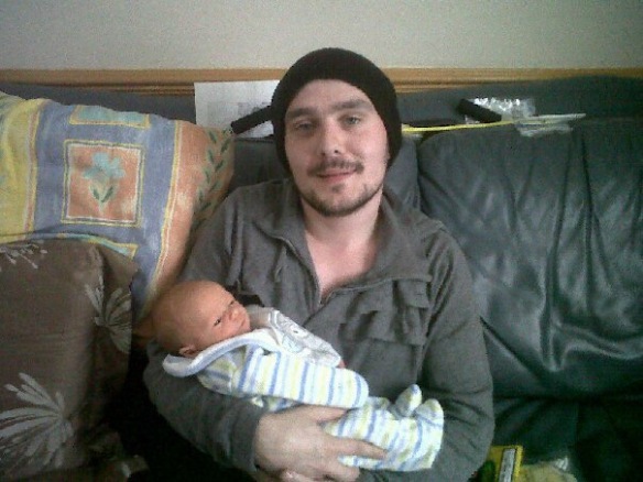 Here I am holding my new born nephew, I was very ill in this picture.